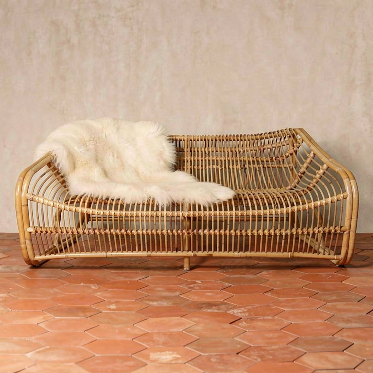 The Furniture Collection by TIBA-TIBA — Bucket 2-seater rattan sofa, Bucket Lounge Chair, and 2 Jetty side tables in a modern concrete loft. 