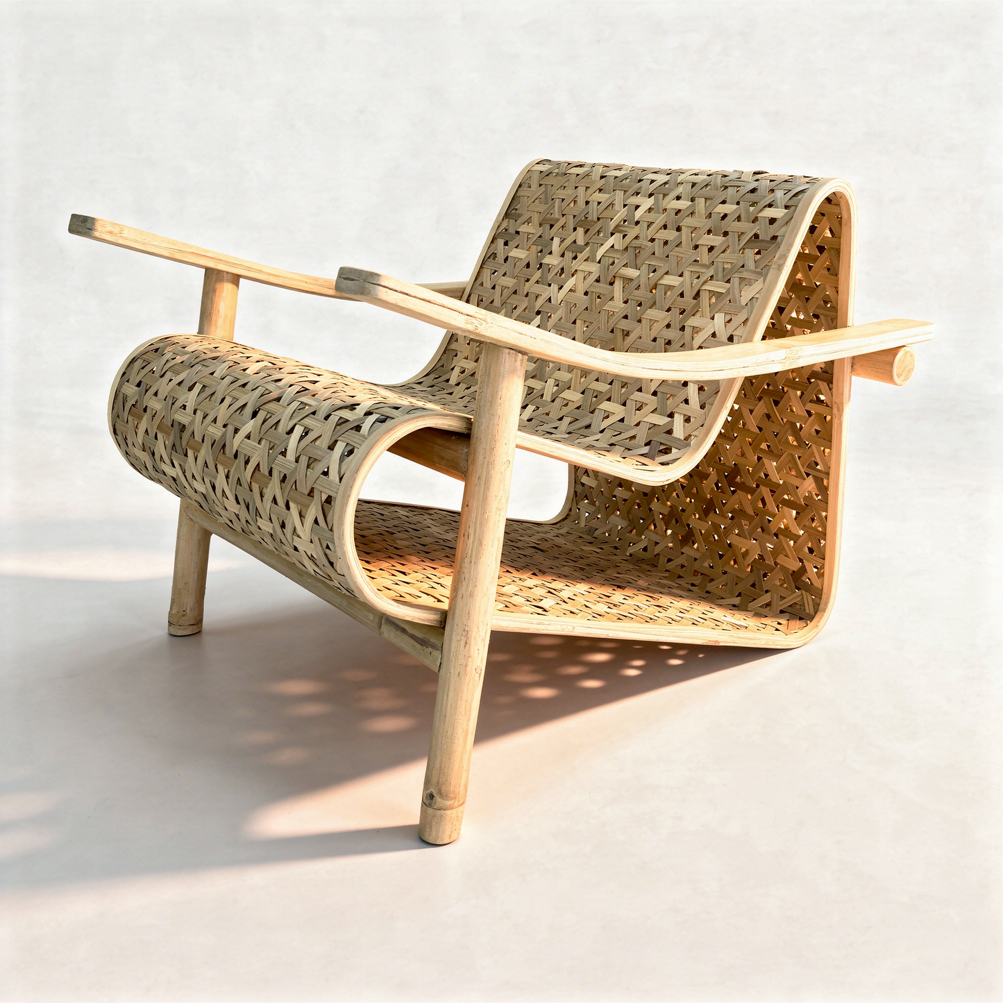 Koo-Boo Lounge Chair by TIBA-TIBA – unique bamboo chair with triangle pattern woven bamboo seat, laminated bamboo arms and bamboo legs, perspective.