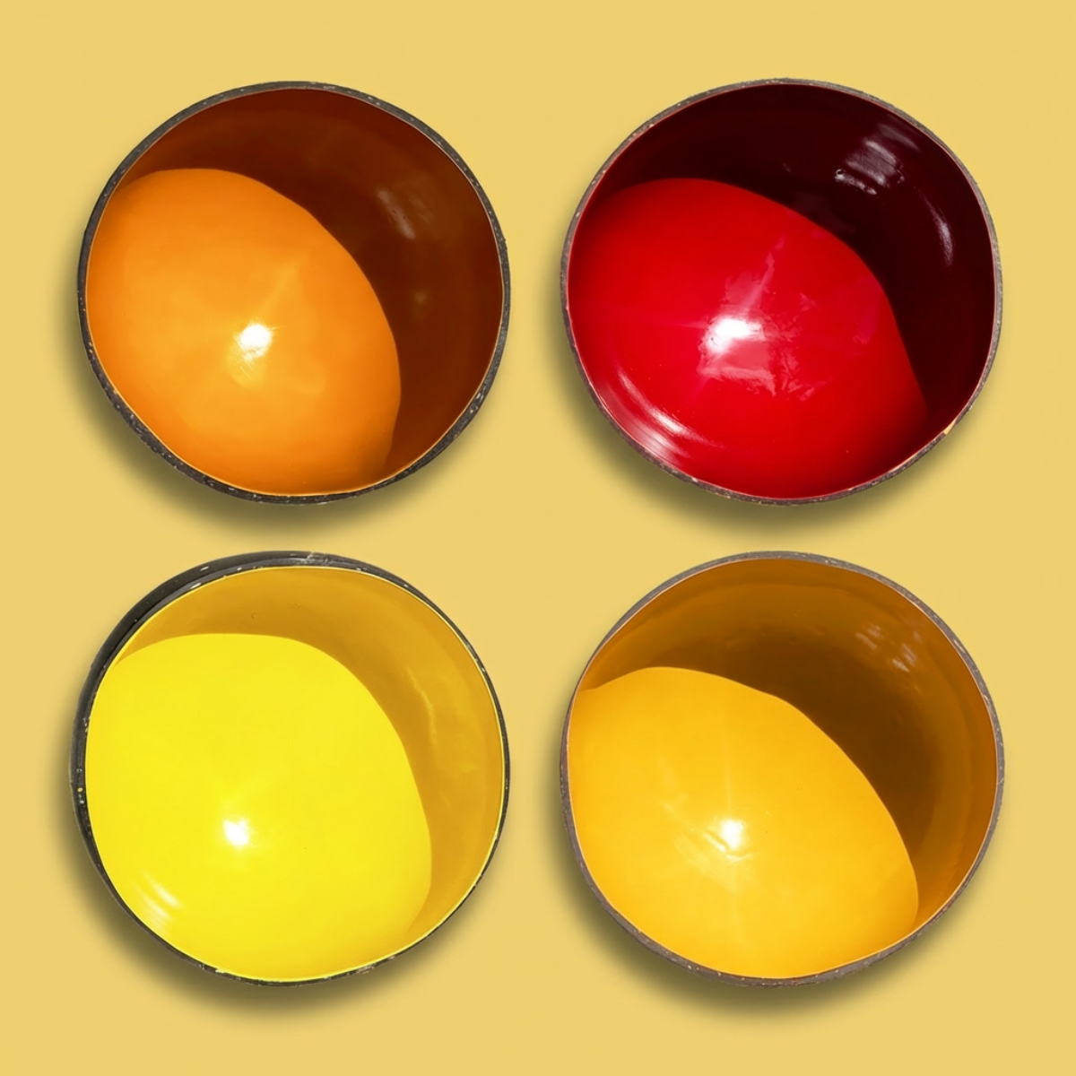Dots 4-Pack Fire Palette by TIBA-TIBA - Four organic coconut bowls in red and orange colours made with non-toxic, food-safe paint.
