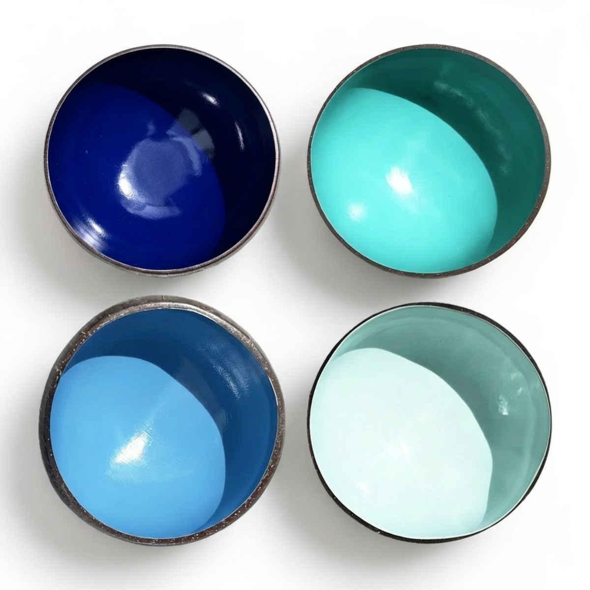 Dots 4 Pack Ocean Palette by TIBA-TIBA - Four tropical tableware coconut breakfast bowls in shades of blue.