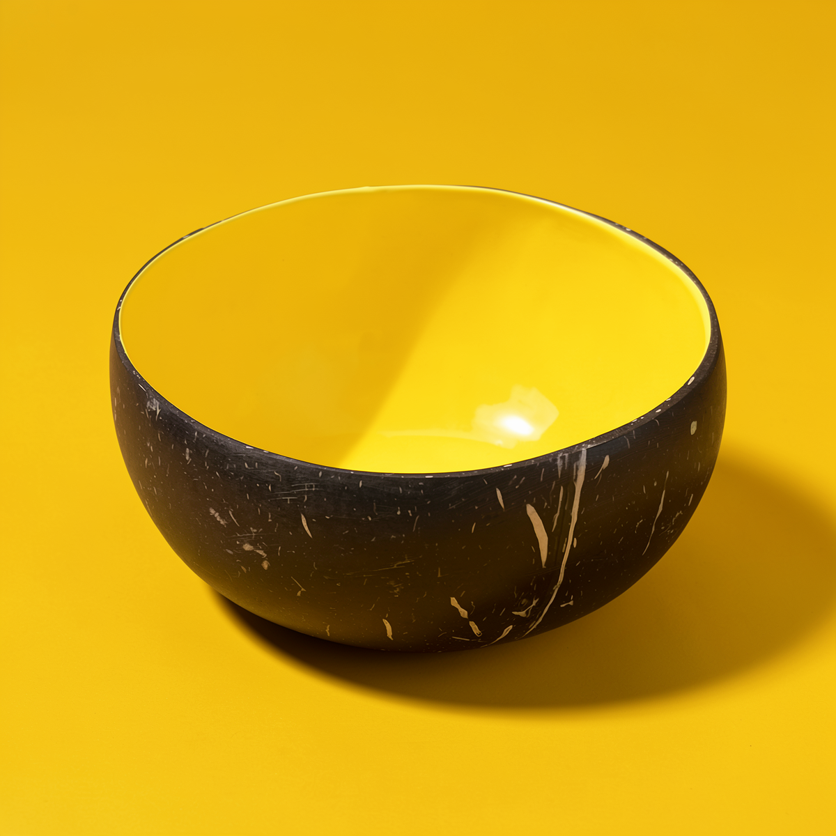Dots Coloured Coconut Bowls by TIBA-TIBA – Pineapple yellow coloured coconut bowl on yellow background. Eco-conscious tableware. 