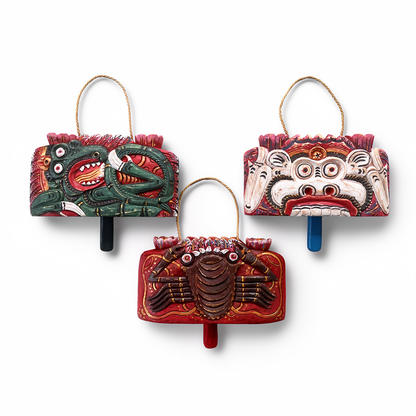 Lonceng Sapi Cowbell by TIBA-TIBA – 
Front view of set of three Solid Mahogany hand-carved Bali cowbells with Dragon, Monkey, and Crab motif.