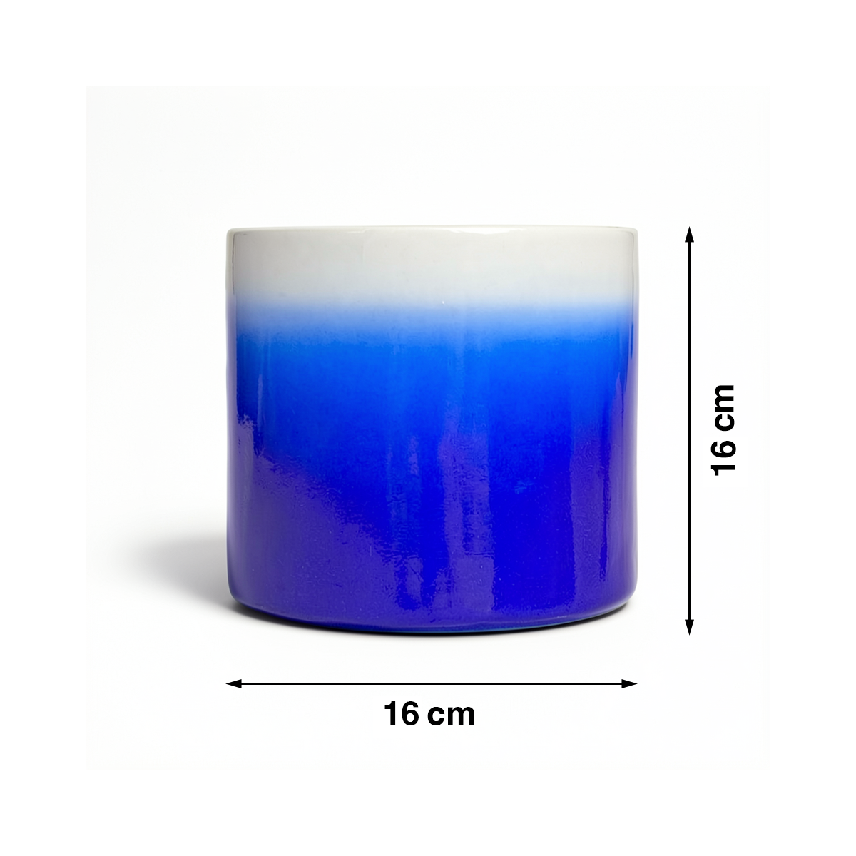 Fade Cylinder planter by TIBA-TIBA – Dark blue ceramic plant pot with a glossy, glazed gradient finish that fades to white at the top. 