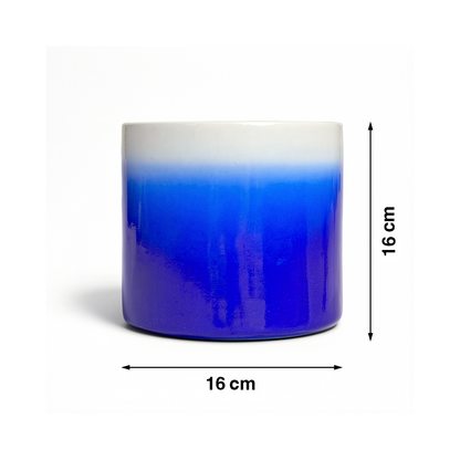 Fade Cylinder planter by TIBA-TIBA – Dark blue ceramic plant pot with a glossy, glazed gradient finish that fades to white at the top. 