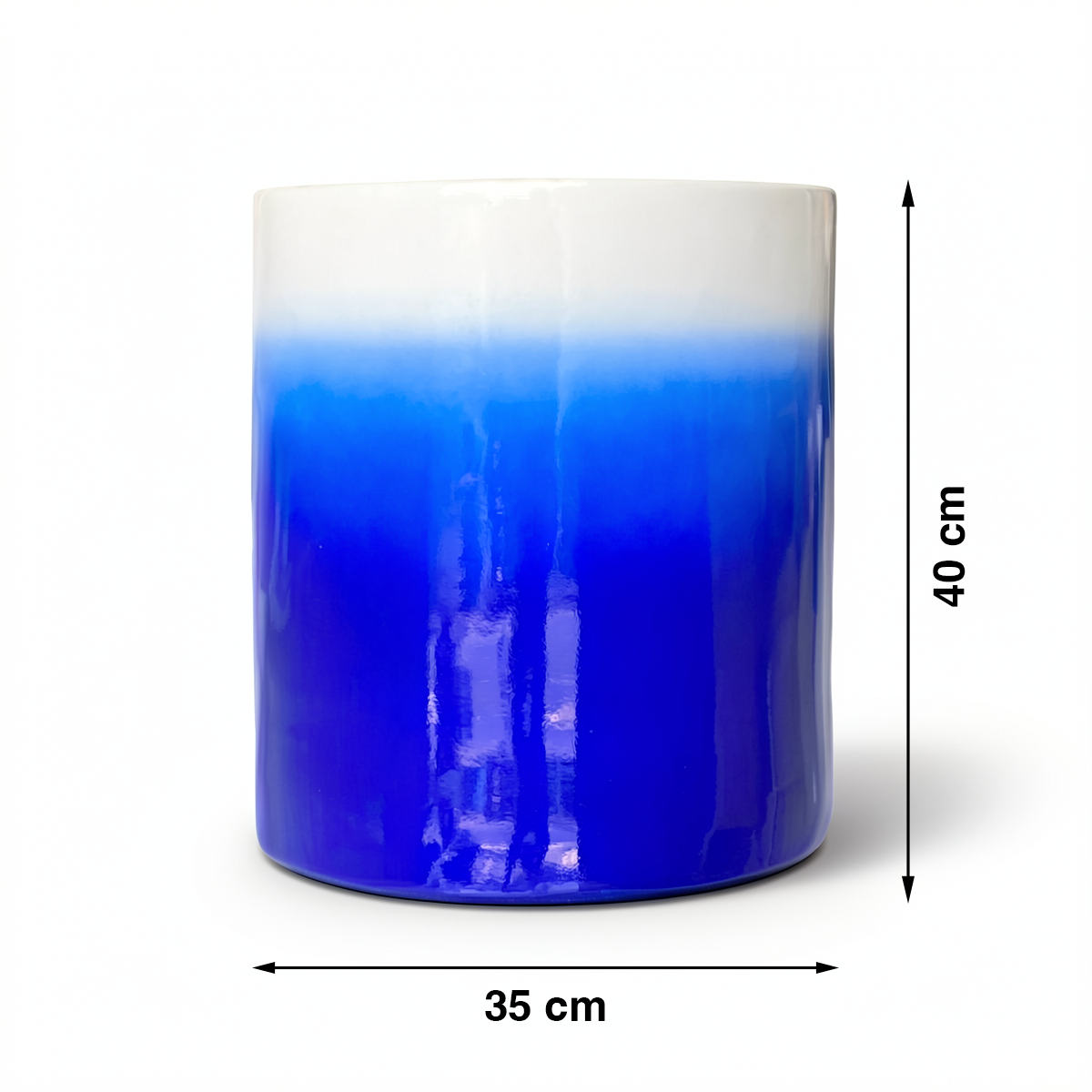 Fade Cylinder planter by TIBA-TIBA – Dark blue ceramic plant pot with a glossy, glazed gradient finish that fades to white at the top. 