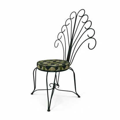 Plume Chair by TIBA-TIBA – steel outdoor peacock chair with green curly metal frame and green geometric round patterned cushion.