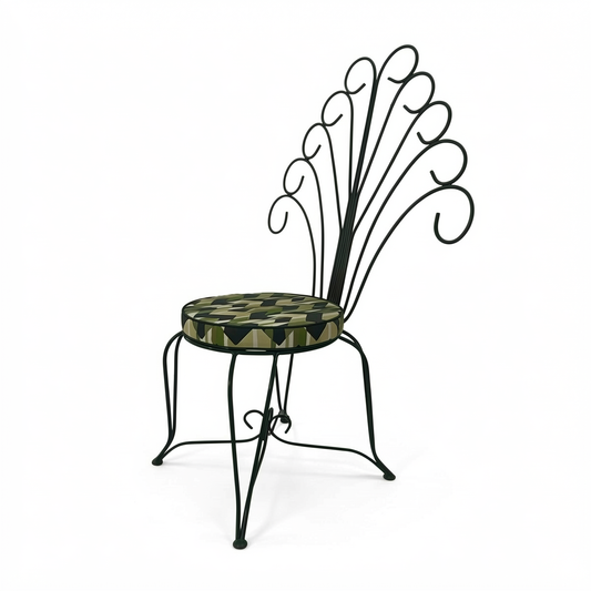 Plume Chair by TIBA-TIBA – steel outdoor peacock chair with green curly metal frame and green geometric round patterned cushion.