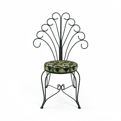 Plume Chair by TIBA-TIBA – powder-coated steel peacock chair with curled metal frame and green patterned outdoor cushion, front view. 