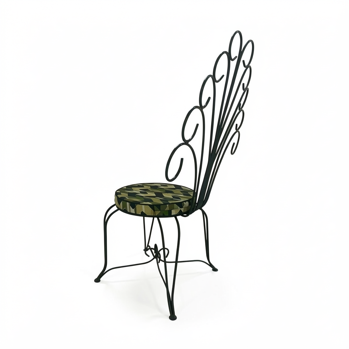 Plume Chair by TIBA-TIBA – powder-coated dark green peacock chair with curved metal frame and green patterned QDF cushion, rear angle view. 