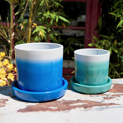 Tatakan plant saucer by TIBA-TIBA – Sky blue and Turquoise Fade pots with matching Tatakan plant drip trays on a rustic table in a Balinese bamboo garden.