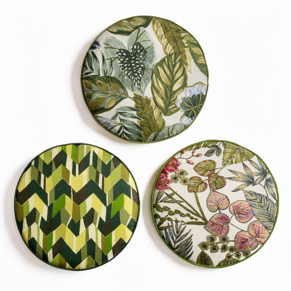 Plume Outdoor Cushion by TIBA-TIBA – three tropical round chair cushions in shades of green with piping and quick dry foam. 