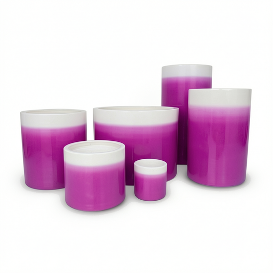 Fade Cylinder planters by TIBA-TIBA – Group of six glossy purple to white ombre ceramic pots of varying sizes.