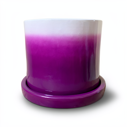Tatakan plant saucer by TIBA-TIBA – purple high-gloss glazed terracotta planter drip tray under purple Fade Pot. 
