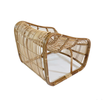 Bucket Lounge Chair by TIBA-TIBA – handwoven natural rattan lounge chair with soft curves and low modern silhouette, crafted in Indonesia for relaxed tropical living.