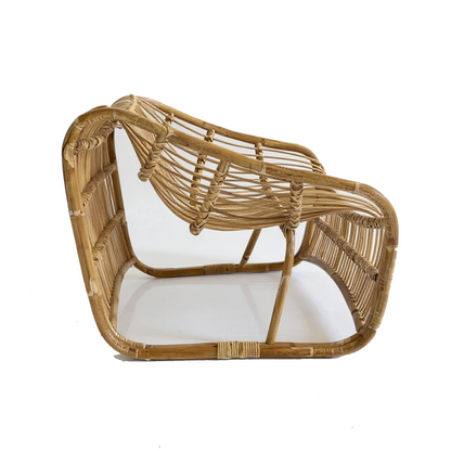 Bucket Lounge Chair by TIBA-TIBA – handwoven natural rattan lounge chair with soft curves and low modern silhouette, crafted in Indonesia for relaxed tropical living.