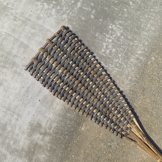 Rattan Fly Swatter by TIBA-TIBA – natural woven rattan fly swatter by Iban Dayak tribe, close up detail of the black rattan weave. 