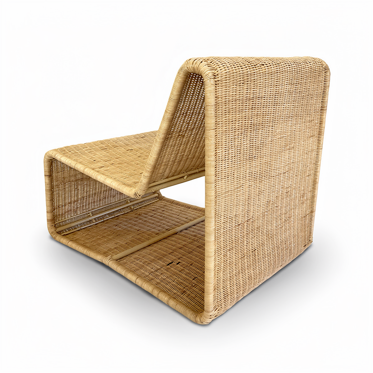 Geo Lounge Chair by TIBA-TIBA – Rear perspective of a tropical lounge chair made of woven rattan with a modern geometric form, natural finish and aluminium frame. 