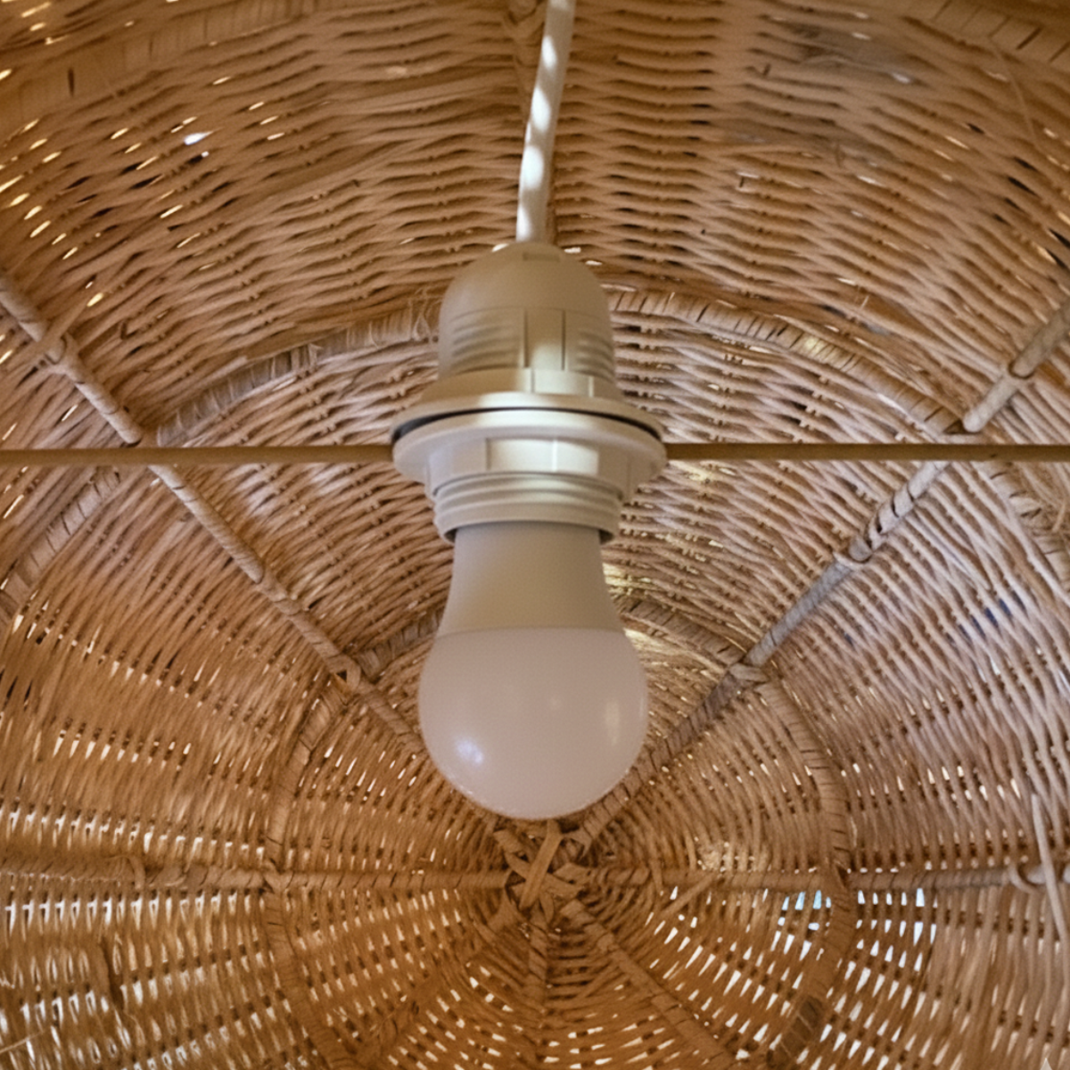 Ikan 60 Rattan Pendant Light by TIBA-TIBA - internal detail of the painted steel frame and white e27 bulb housing for Ikan 60 rattan fish pendant lamp. 