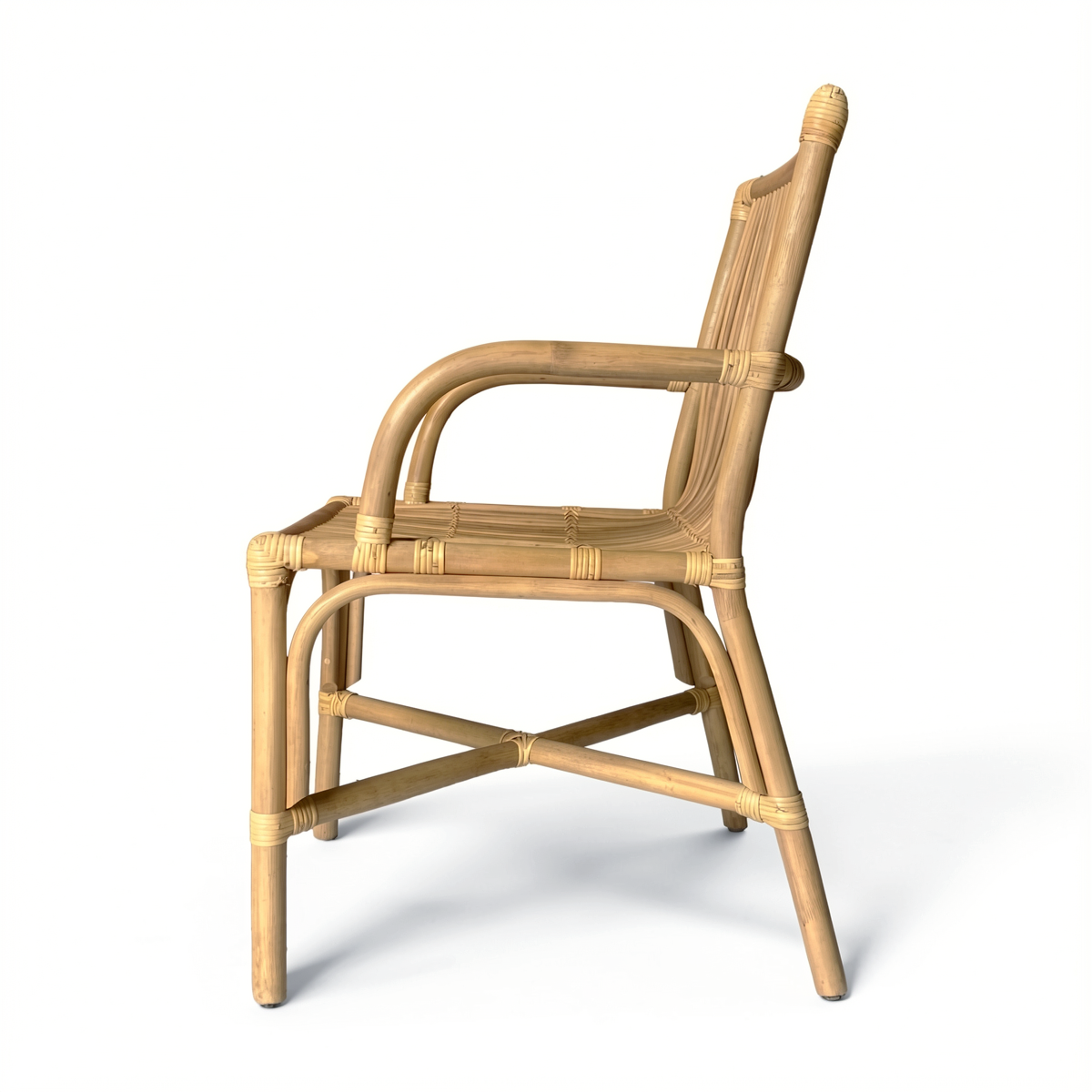 Ro-Di-O Dining Chair by TIBA-TIBA – Handcrafted Indonesian natural wicker dining chair with curved arms and minimalist frame. Side view.