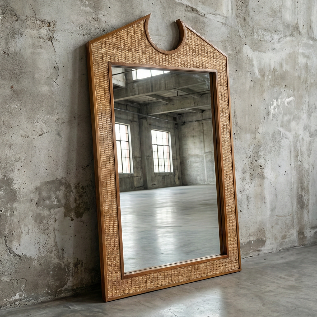 Chippendale Standing Mirror by TIBA-TIBA - Post Modern design rattan and teak mirror leaning against concrete wall 