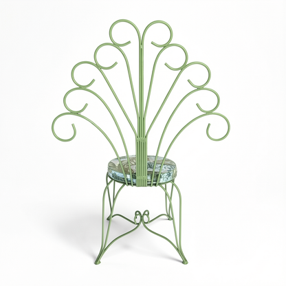 Plume Chair by TIBA-TIBA – powder-coated sage green steel peacock chair with decorative metal frame and green and blue jungle foliage patterned QDF cushion, rear view.