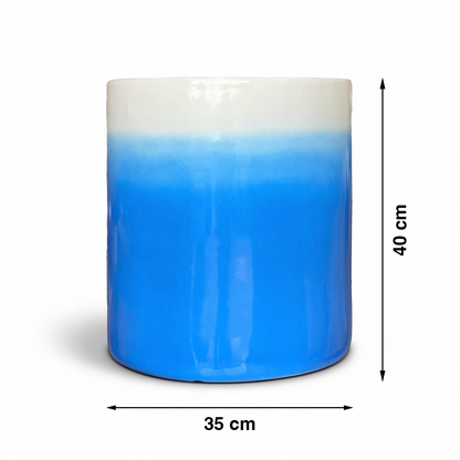 Fade Cylinder planter by TIBA-TIBA – Sky blue ceramic plant pot with a glossy, glazed gradient finish that fades to white at the top. 