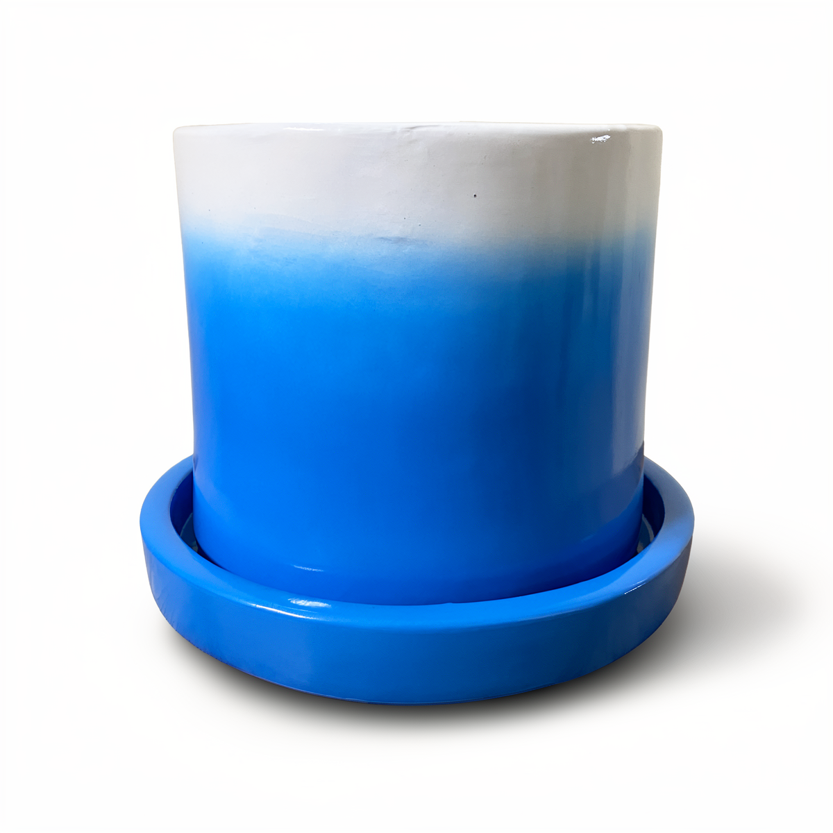 Tatakan plant saucer by TIBA-TIBA – sky blue high-gloss glazed terracotta planter drip tray under sky blue Fade Pot. 