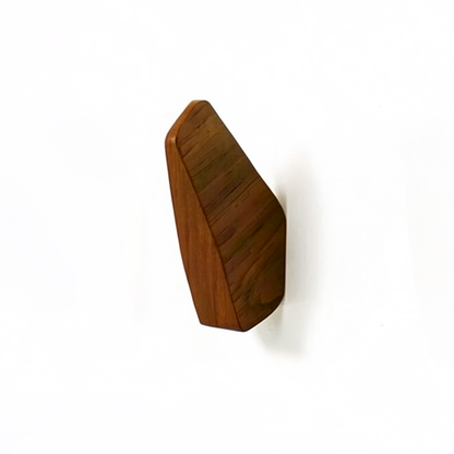 Fin Wall Hook by TIBA-TIBA -  Minimalist teak wall hook mounted on a white wall. 