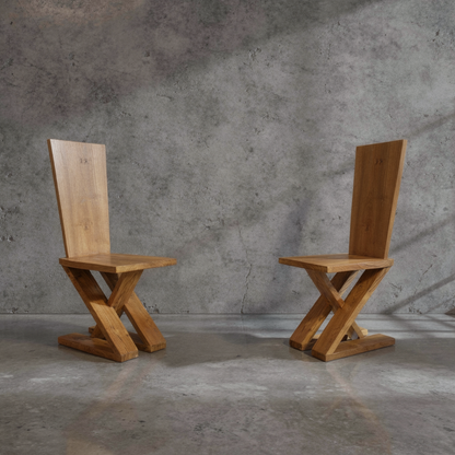 Zag-Zig Chair by TIBA-TIBA – Two chunky, brutalist teak wood chairs cut from a single plank of wood on concrete background.   