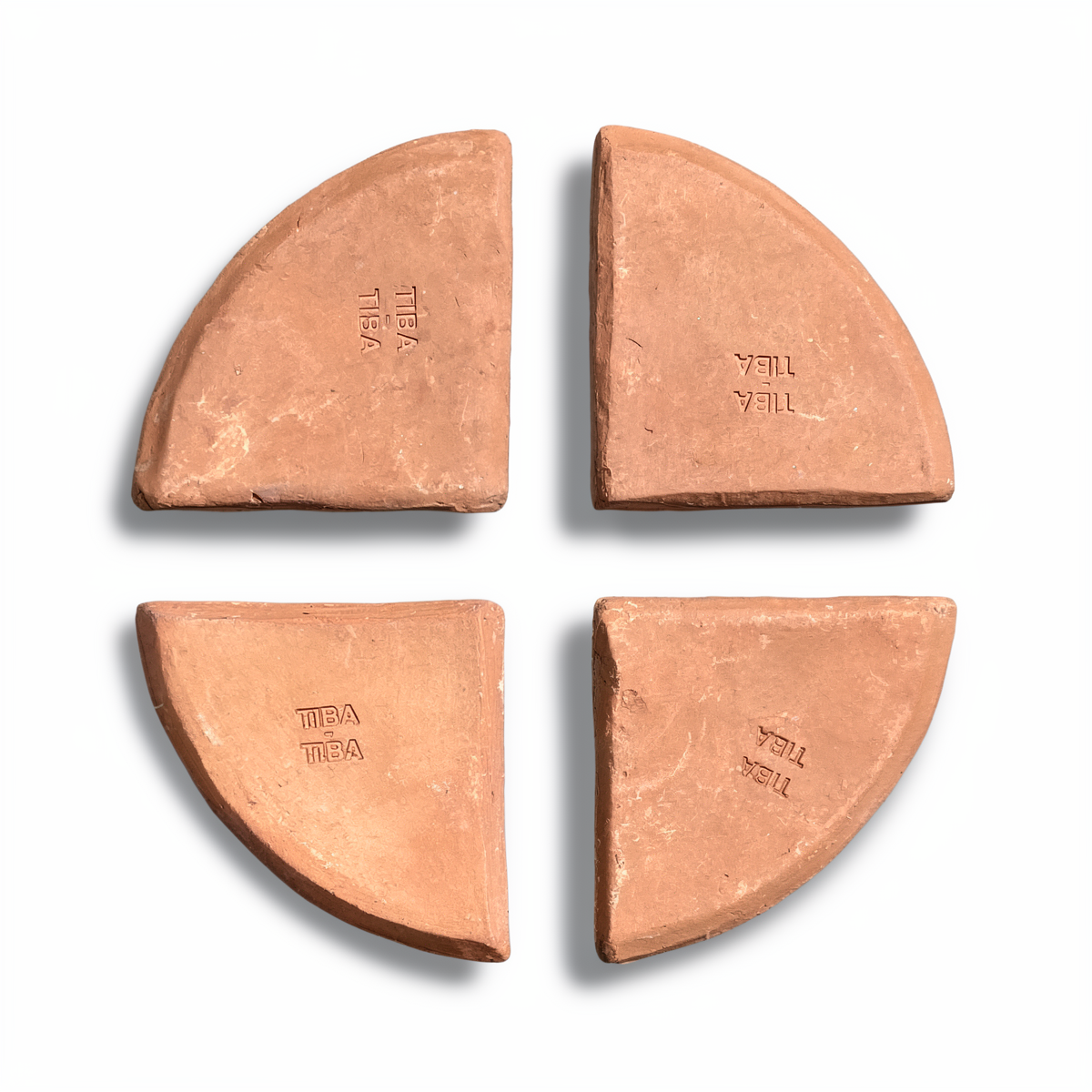 Po-Ka Pot feet by TIBA-TIBA - set of four hand-crafted terracotta wedges for planter drainage and airflow on white background. 
