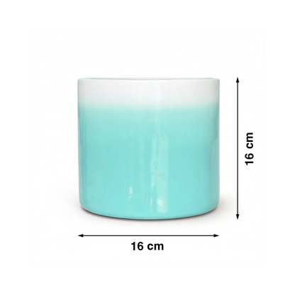 Fade Cylinder planter by TIBA-TIBA – Turquoise ceramic plant pot with a glossy, glazed gradient finish that fades to white at the top. 