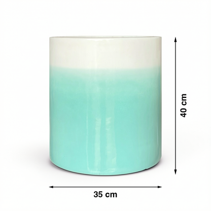 Fade Cylinder planter by TIBA-TIBA – Turquoise ceramic plant pot with a glossy, glazed gradient finish that fades to white at the top. 