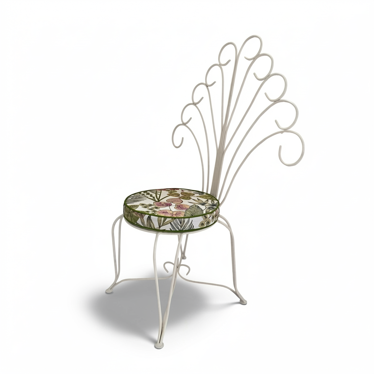 Plume Chair by TIBA-TIBA – powder-coated steel outdoor peacock chair with white curled frame and floral patterned cushion.
