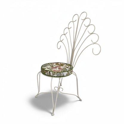 Plume Chair by TIBA-TIBA – powder-coated steel outdoor peacock chair with white curled frame and floral patterned cushion.