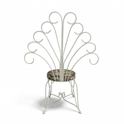 Plume Chair by TIBA-TIBA – white curved metal garden peacock chair with decorative metal backrest and a green foliage outdoor cushion