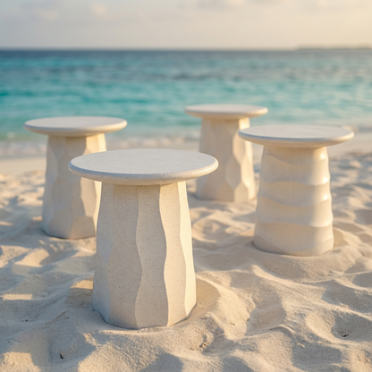 Jetty Side Table by TIBA-TIBA - group of four terrazzo outdoor side tables with geometric carved motifs in sand at tropical beach. 