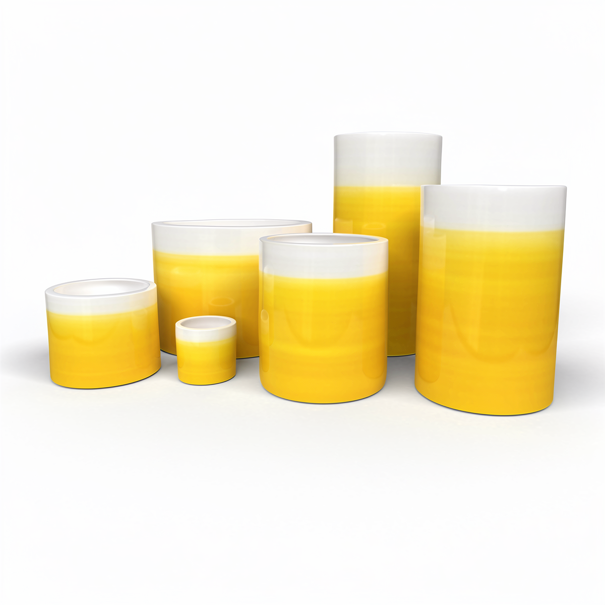 Fade Cylinder planters by TIBA-TIBA – Collection of six yellow terracotta pots of varying sizes with a glossy, glazed gradient finish.